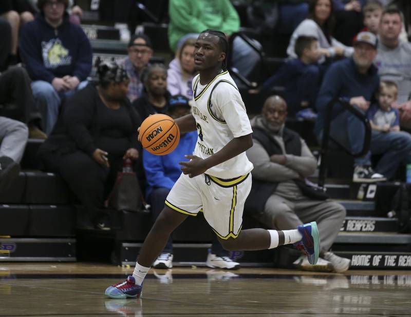 Yorkville Christian's Jayden Riley (3) races down the court during their Plano Christmas Classic basketball game between Morris at Yorkville Christian Friday, Dec 26, 2025 in Plano.