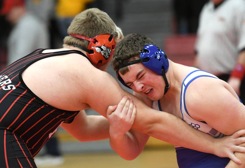 Princeton's Cade Odell grimaces as he wrestles Fulton's Braiden Damhoff in their 285-pound match at the 1A Oregon Wrestling Sectional on Friday night.