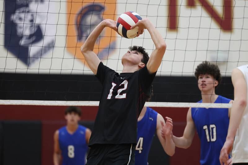 Plainfield North’s Jake Hill sets the ball against Lincoln-Way East on Tuesday, April 2, 2024.