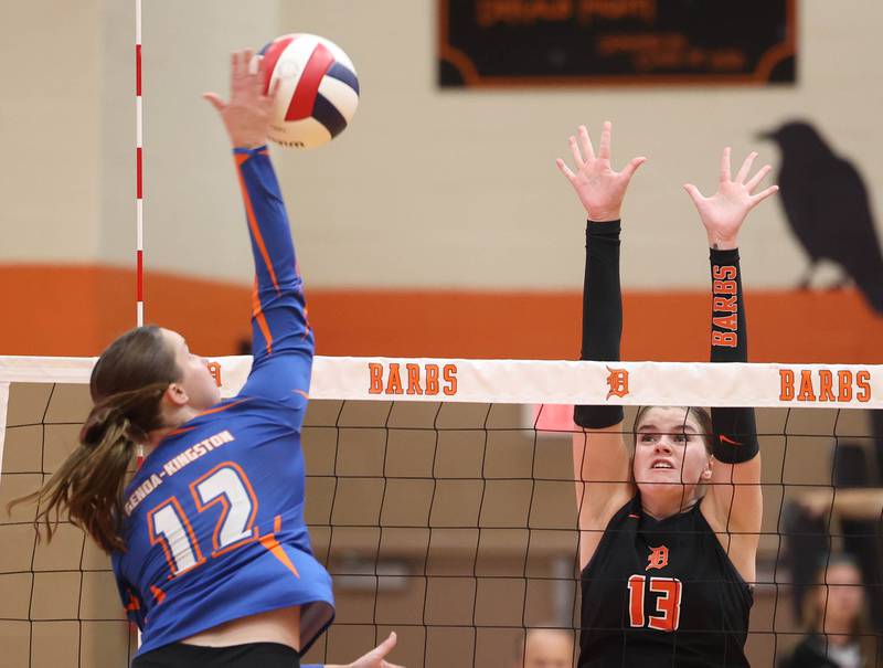 Genoa-Kingston's Jessie Fredrickson tries to spike the ball past DeKalb's Camryn Hilliard during their match Wednesday, Sept. 10, 2025, at DeKalb High School.
