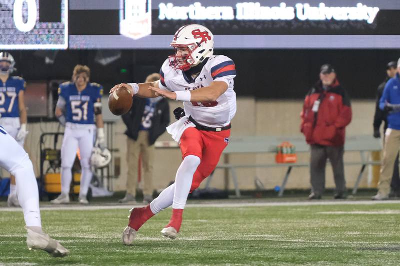 St. Ritas Tommy Ulatowski scrambles to the outside against Wheaton North in the Class 7A state championship at NIU Huskie Stadium. Saturday, Nov. 27, 2021 in DeKalb.