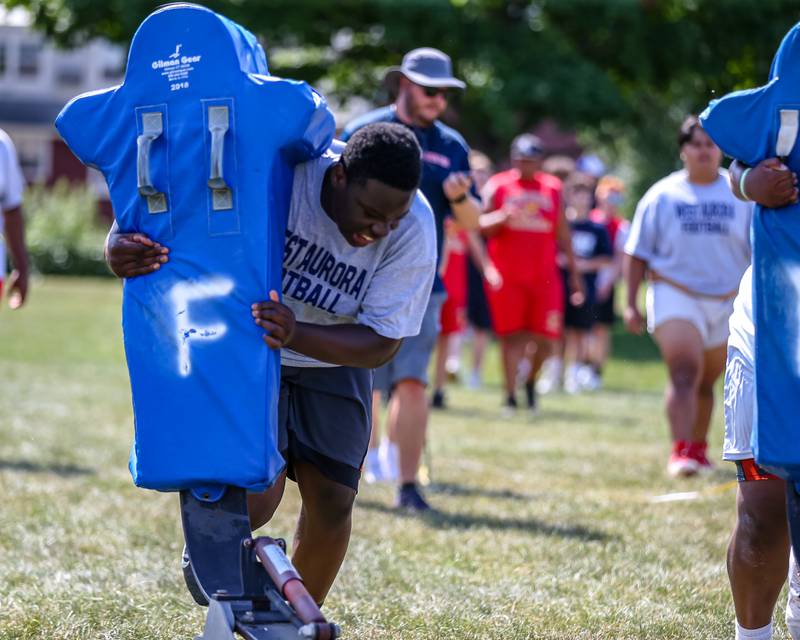West Aurora competes in the sled challenge at the West Aurora High School Battle of the Big Butts Linemen Challenge.  July 14, 2022.
