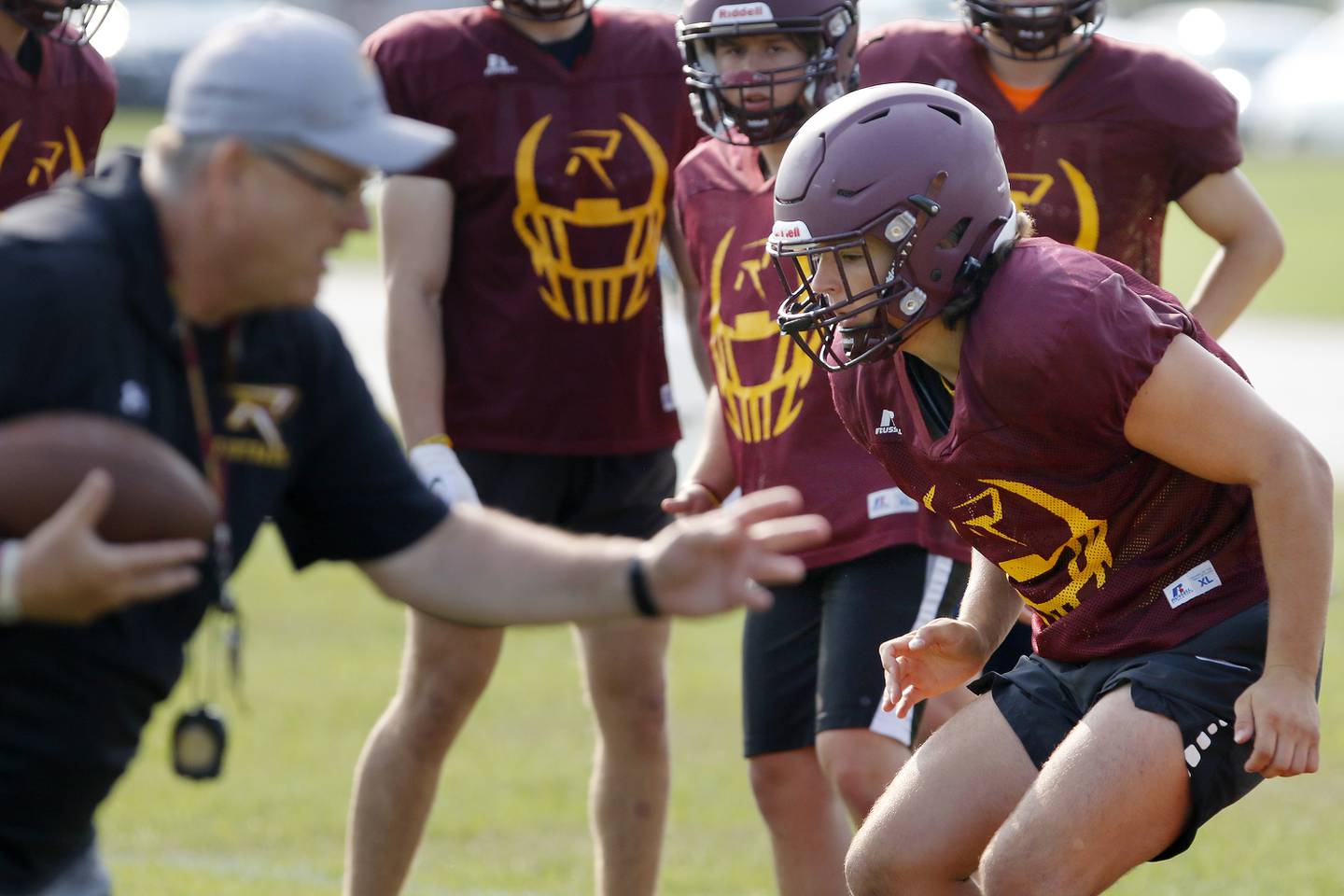Brock Wood, right, works the drills during practice with the varsity football team at Richmond-Burton High School on Wednesday, July 14, 2021 in Richmond.