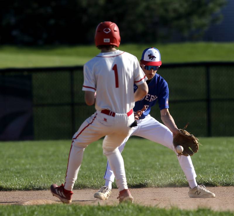 Dundee-Crown's Brady Benton fields the throw as Huntley's Tyler Jakubowski steals second base during a Fox Valley Conference baseball game on Friday, May 9, 2025, at Huntley High School.