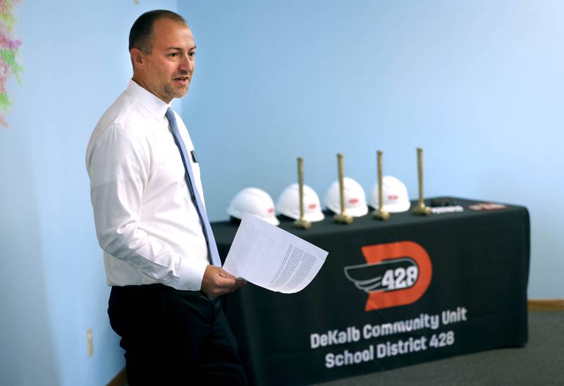 Kyle Gerdes, director of student services for DeKalb School District 428, talks about the plans for the new transition program facility Friday, Aug. 9, 2024, as the ceremonial demolition hammers wait to be used during the Beyond One Barb Transition Center Construction Kick-Off event at the new site at 530 Charter St. in DeKalb.