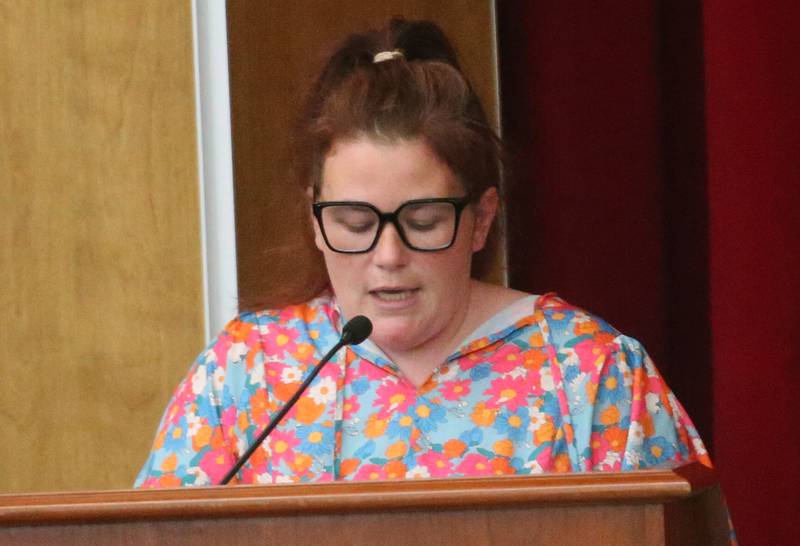 Samantha Petersen speaks to the Illinois Health Facilities and Services Review Board during a public hearing regarding OSF St. Elizabeth Hospital's plans to reduce services on Tuesday, June 10, at Central Intermediate School in Ottawa.