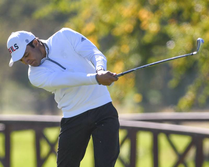 Hinsdale Central's Dru Devata tees off during the 3A sectional match held at Blackberry Oaks Golf Course in Bristol..