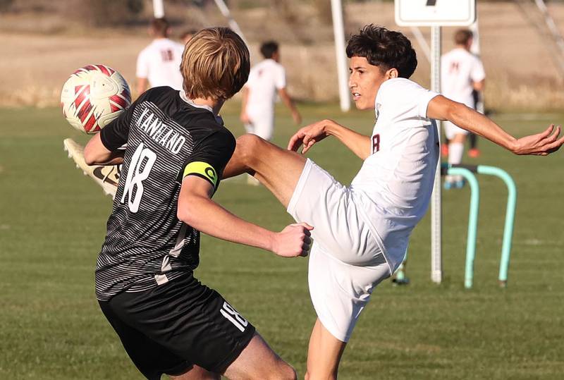 DeKalb's Erick Talamantes tries to kick the ball over Kaneland's Matthew Mitchinson during their game Thursday, Oct. 17, 2024, at Kaneland High School in Maple Park.