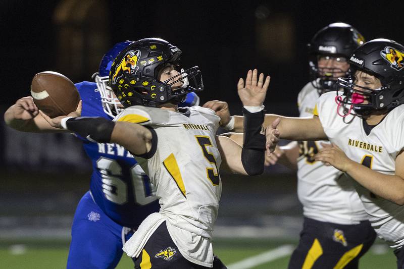 Riverdale’s Kolton Kruse fires a pass downfield Friday, October 11, 2024, against Newman.