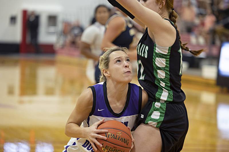 Dixon’s Hannah Steinmeyer works against Rock Falls’ Emily Lego Thursday, June 15, 2023 during the Sauk Valley Media All-Star Basketball Classic at Sauk Valley College.