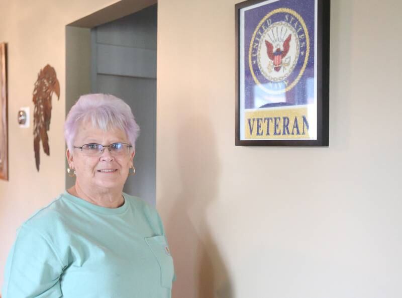 Navy Veteran Kathy Lawyer, poses in her home on Wednesday, Sept. 3, 2025 in Oglesby.