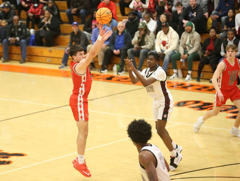 L-P's Erick Sotelo fires a jump shot over Peoria's Jacob Duffin Jr. during the Class 3A Sectional semifinal game on Wednesday, March 5, 2025 at Washington High School.