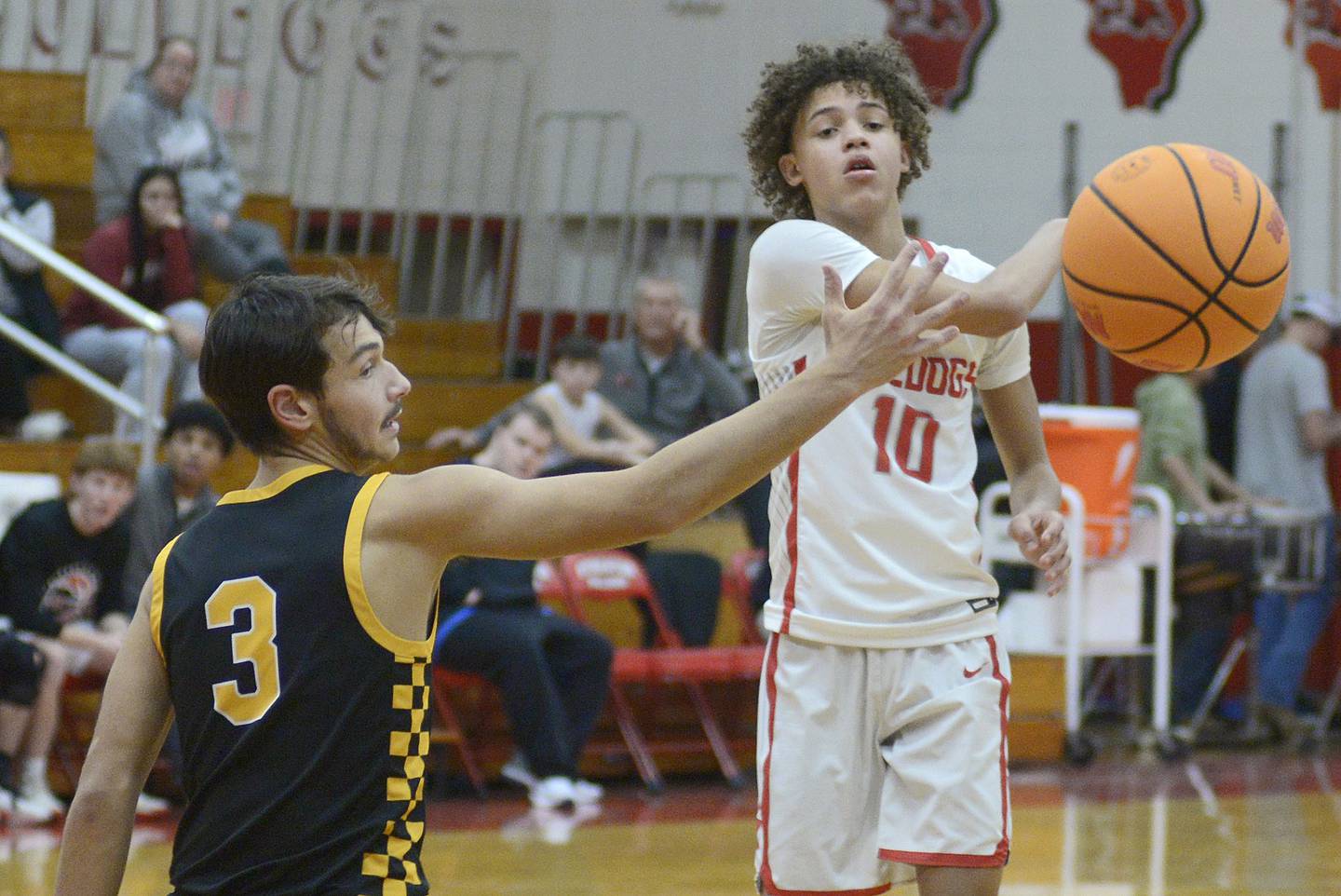 Reed-Custer's Jesse Tresouthick (3) defends Streator’s Christian Bruton (10) Tuesday, Dec. 16, 2025, at Pops Dale Gymnasium in Streator.