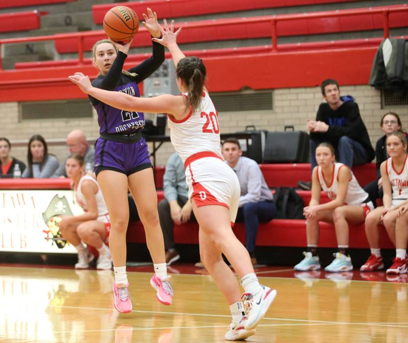 Dixon's Reese Dambman shoots a jump shot over Ottawa's Kendall Lowery on Wednesday, Nov. 29, 2023 at Kingman Gym.