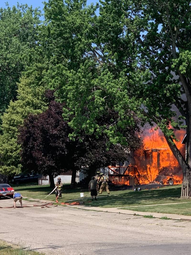 A house on the 200 block of East Caroline Street in Spring Valley is full engulfed in flames Saturday, June 10, 2023.