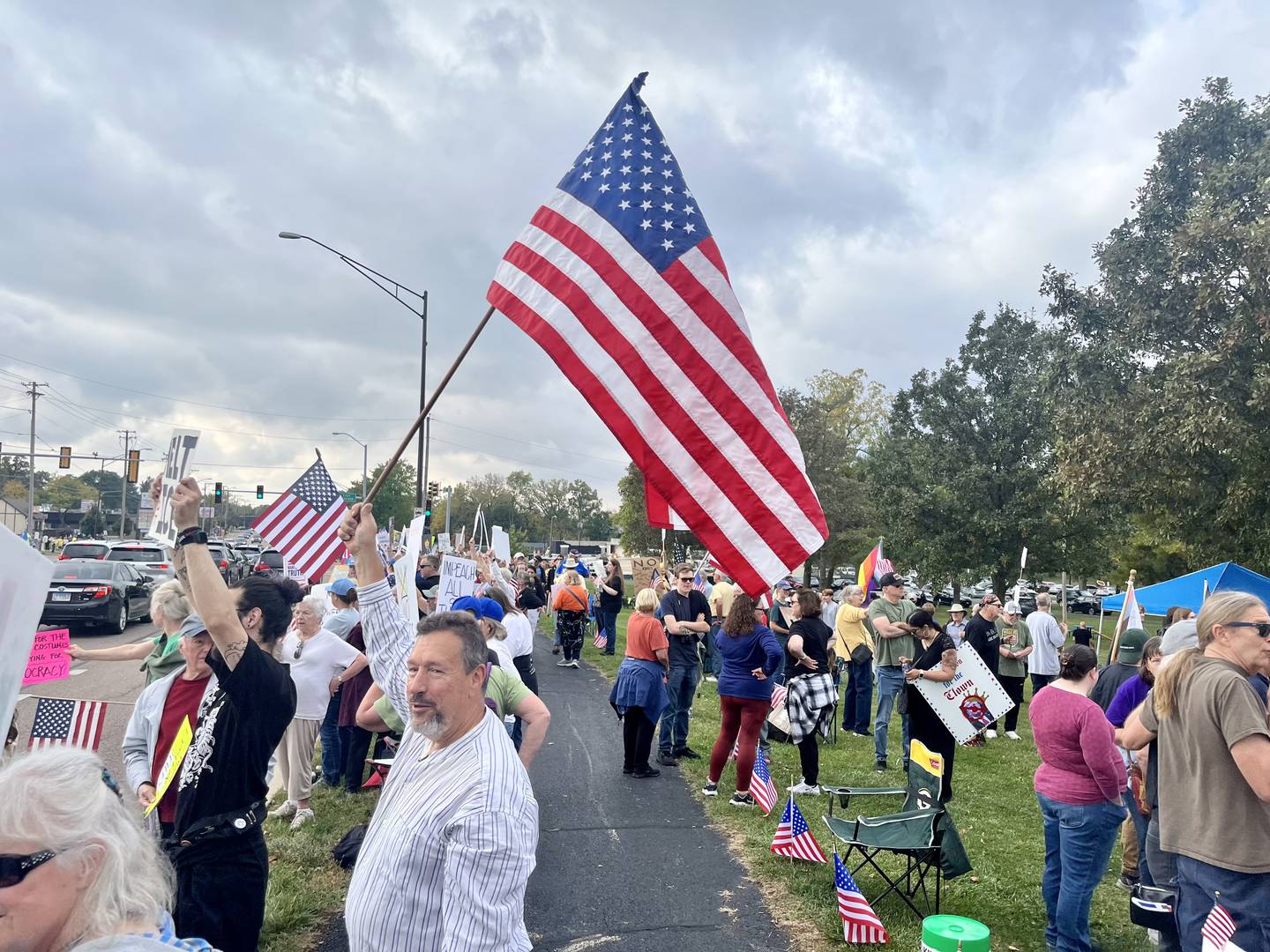Protesters encouraged cars to honk in solidarity at the “No Kings” protest in DeKalb on Oct. 18, 2025.