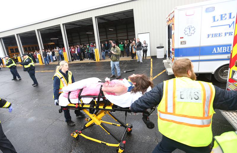 Brynn Pennington a student at Leland High School, is transported by ambulance during a Mock Prom drill at Leland High School on Friday, May 6, 2022 in Leland.
