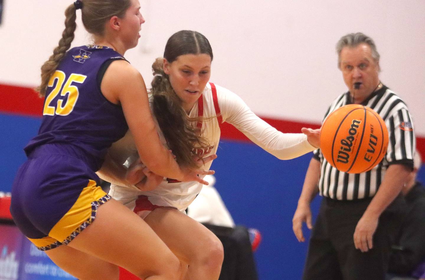 Huntley’s Evelyn Freundt drives with the ball against Hononegah in girls basketball at Dundee-Crown High School in Carpentersville on Tuesday, November 25, 2025.