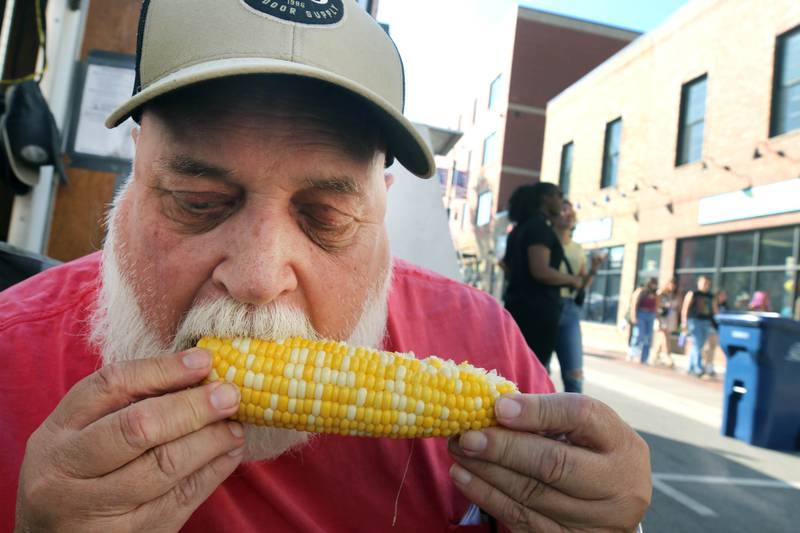 Cliff Golden, from DeKalb, samples some sweet corn Friday, Aug. 23, 2024, during the DeKalb Corn Fest.