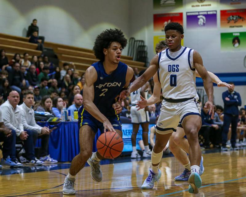 Leyden's Drelyn Jones (2) drives baseline during basketball game between Leyden at Downers Grove South. Feb 9, 2024.