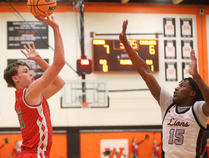 L-P's Jameson Hill shoots a jump shot over Peoria's Fenix Foy during the Class 3A Sectional semifinal game on Wednesday, March 5, 2025 at Washington High School.