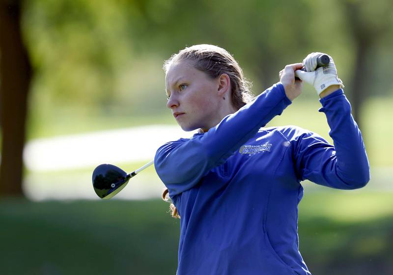 Ava Hartnett of Wheaton North, watches her drive during the IHSA Class 2A West Chicago girls golf regional at St. Andrews Tuesday, Oct. 1, 2024 in West Chicago.