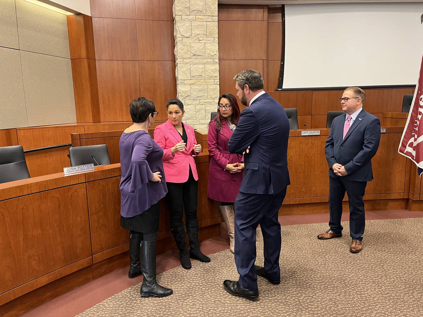 Illinois House Assistant Majority Leader Natalie Manley (left), Illinois State Comptroller Susana Mendoza, State Rep. Dagmara Avelar and State Rep. Harry Benton speak after a press conference held on Monday in Romeoville about legislation modifying the Illinois Line of Duty Compensation Act.