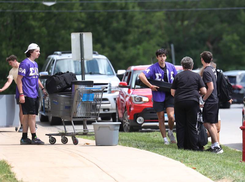 Students unload vehicles Wednesday, Aug. 21, 2024, outside Patterson Hall as new students move in during move-in day at NIU in Dekalb.