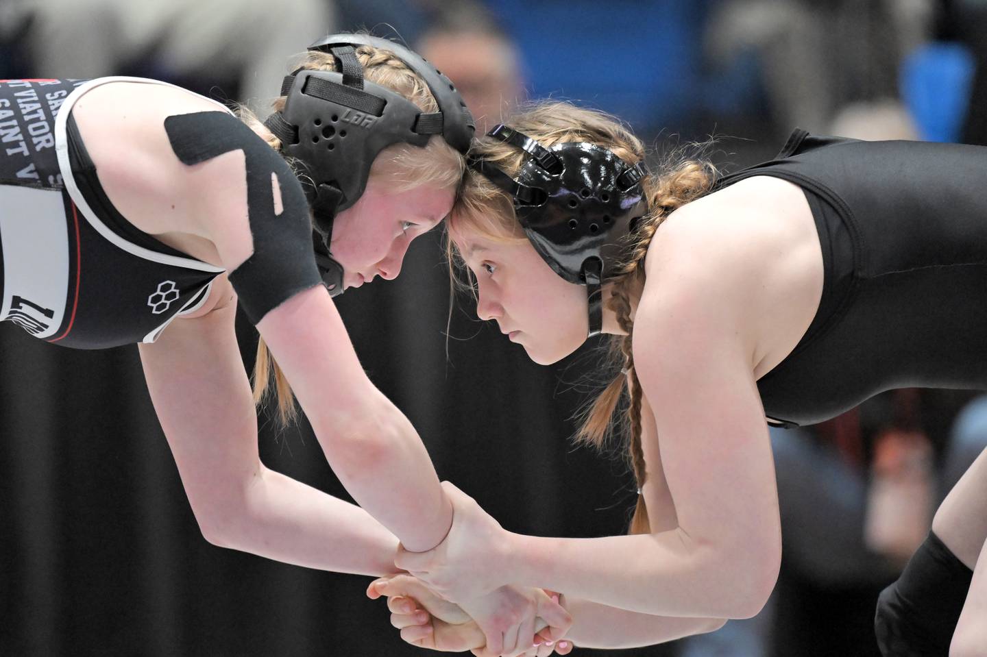 Saint Viator’s Charlotte Nold, left, and Glenbard East’s Nadiia Shymkiv wrestle in the 105-pound class at the girls wrestling state finals tournament at Grossinger Arena in Bloomington on Saturday, Feb. 28, 2026.