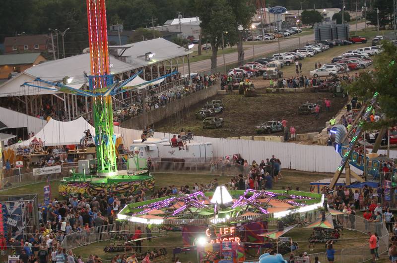 Fans pack the demolition derby and carnival rides during the 168th annual Bureau County Fair on Saturday, Aug. 26, 2023 in Princeton.