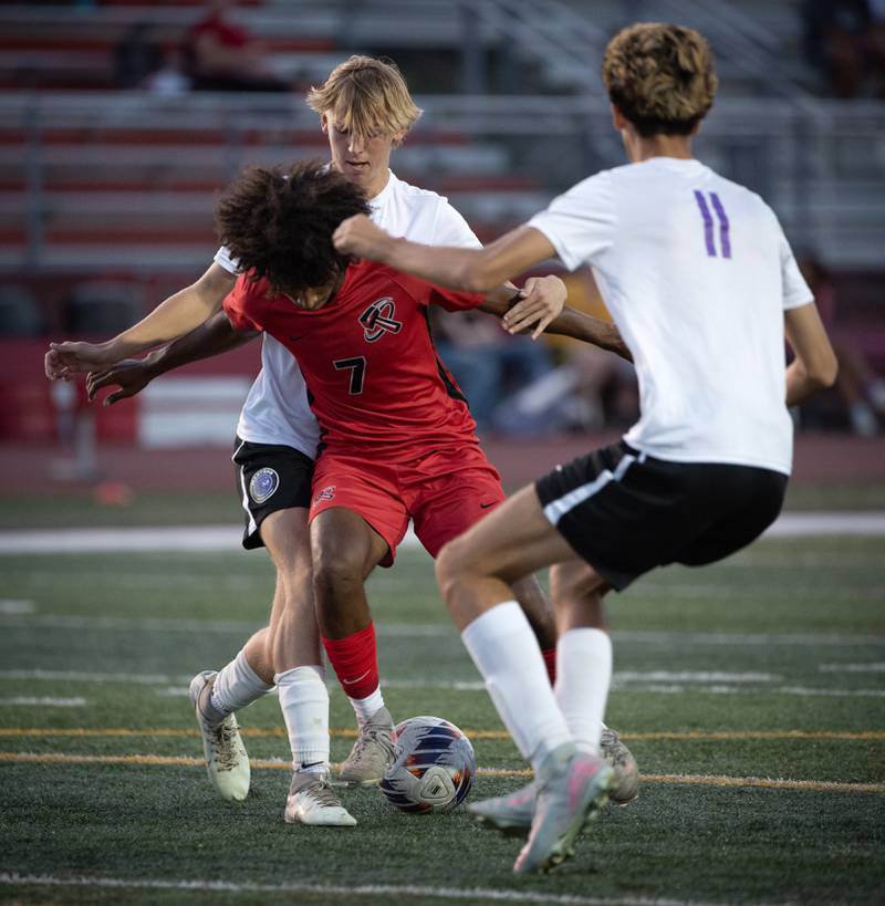 Bradley-Bourbonnais' Josh Jones, center, controls the ball as Manteno's Jake Krisko, back, and Braden Campbell, right, defend in a game on Tuesday, September 16, 2025.