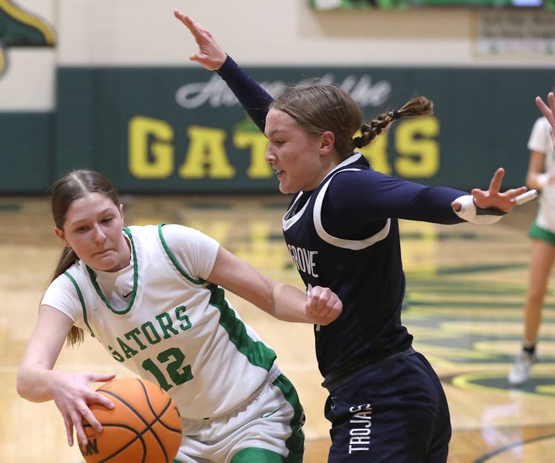 Crystal Lake South's Gaby Dzik drives the baseline against Cary-Grove's Aria Stanton during a Fox Valley Conference girls basketball game on Friday, Jan. 23, 2026, at Crystal Lake South High School.
