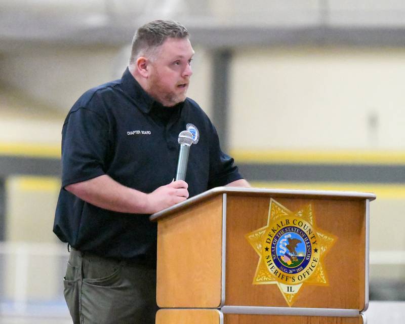 Mike McTighe, vice president of Illinois Concerns of Police Survivors, speaks during a memorial vigil to mark one year since the late sheriff's deputy Christina Musil, 35, was killed in the line of duty in a rear-end car crash in Waterman while on patrol on March 28, 2024. The vigil was held at the Sycamore High School Field House on Saturday, March 29, 2025.