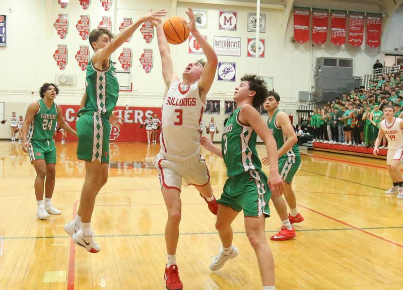 Streator's Nolan Ketcham looses control of the ball in the lane as L-P's Jameson Hill and Mikey Hartman defend during the Class 3A Regional title game on Friday, Feb. 28, 2025 in Sellett Gymnasium at L-P High School.
