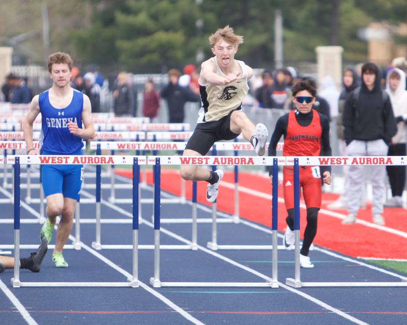 Sycamore's Xander Lewis clears the last hurdle followed by Geneva's Jackson Avery and South Elgin's Hassel Colula in the 110 Meter Hurdles at the Peterson Prep Invitational by Kaneland on Saturday, April 20,2024 at West Aurora High School in Aurora.