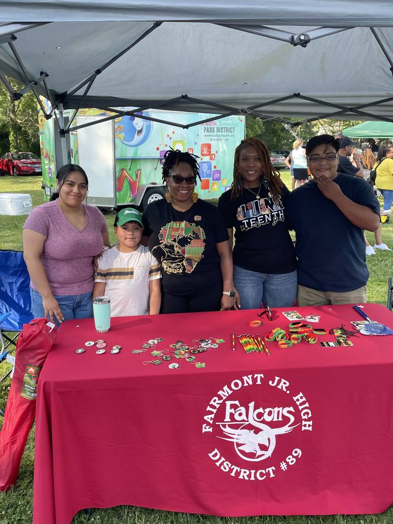 Rachel Clayton, cafeteria manager at Fairmont School in Lockport, is seen with Elisabeth Patton, Fairmont School principal, and members of the Adame family. Patton said Clayton "goes above and beyond to enrich the school environment.'