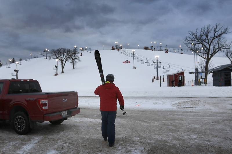Nick Capp of Antioch walks to Wilmot Mountain Ski Resort to ski on Thursday, Jan. 16, 2025, in Wilmot, Wisconsin.