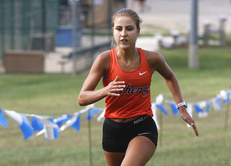 McHenry’s Danielle Jensen wins the girls race of the McHenry County Cross Country Meet Saturday, August 27, 2022, at Emricson Park in Woodstock.