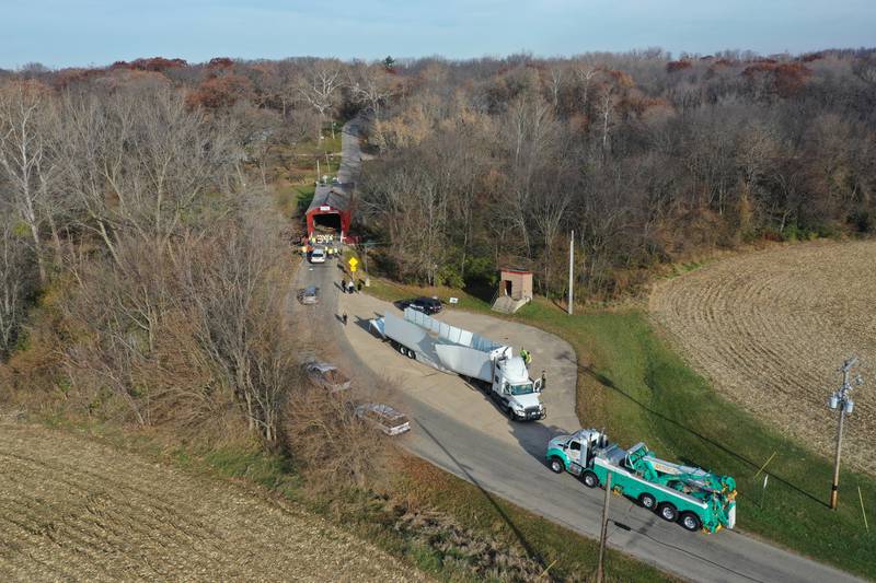 An aerial view of the damage of the Red Covered Bridge and semi truck that struck the bridge on Thursday, Nov. 16, 2023 in Princeton. Illinois Department of Transportation, Illinois State Police and Bureau County law enforcement survey the damage after the semi-truck severely damaged the bridge.