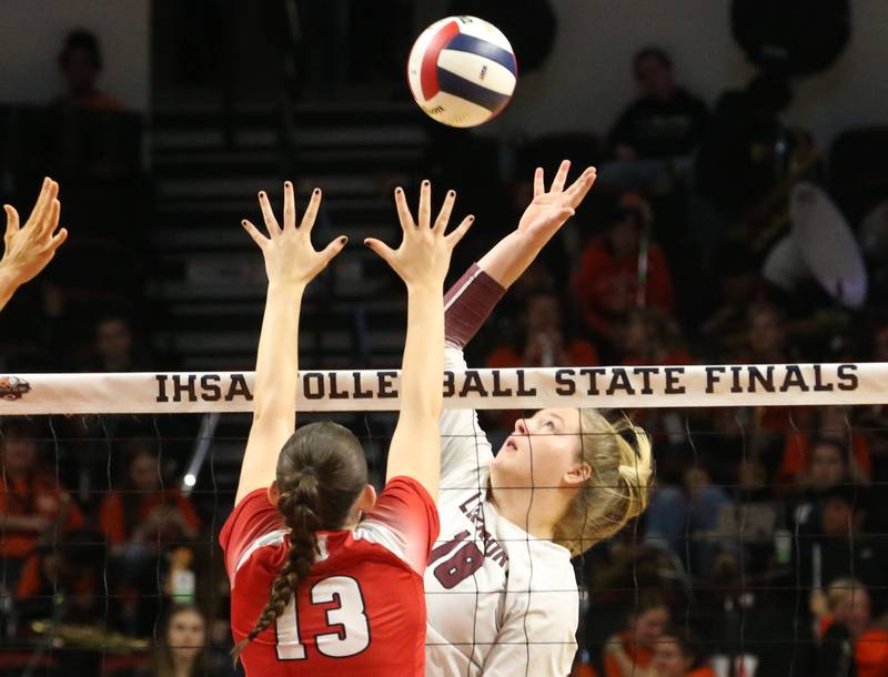 Lockport's Jenna Kolosta hits the ball over the net past Marist's Brooke Conlan during the Class 4A State semifinal game on Friday, Nov. 15, 2024 at CEFCU Arena in Normal.