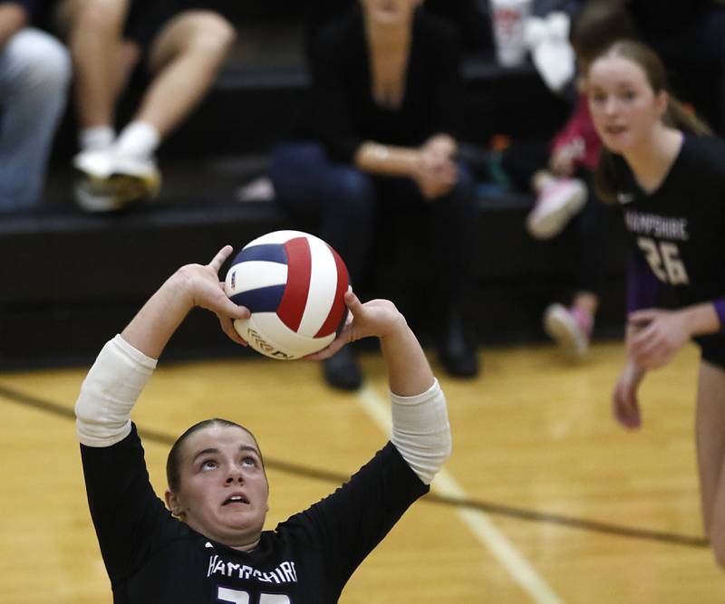 Hampshire's Kylie Lambert sets the ball during an IHSA Class 4A McHenry Sectional volleyball match against Libertyville on Tuesday, Nov. 5, 2024, at McHenry High School Freshman Campus.
