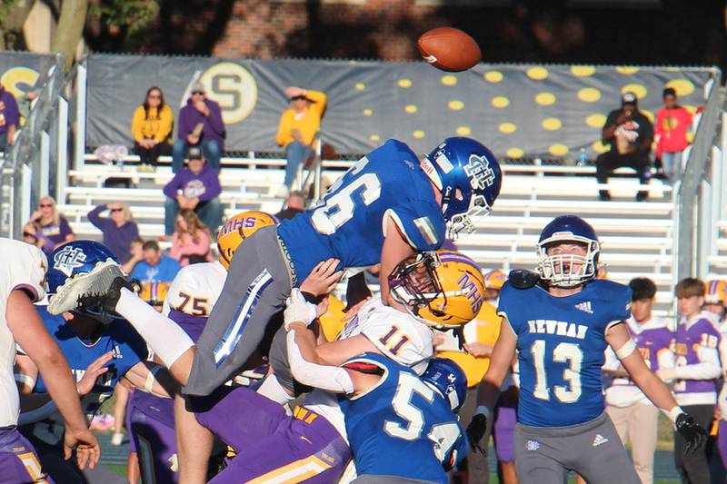 Newman’sJacob Newberry (top) and Jacob Payne take down Mendota’s Aden Tillman Saturday, Sept. 7, 2024, in Sterling.