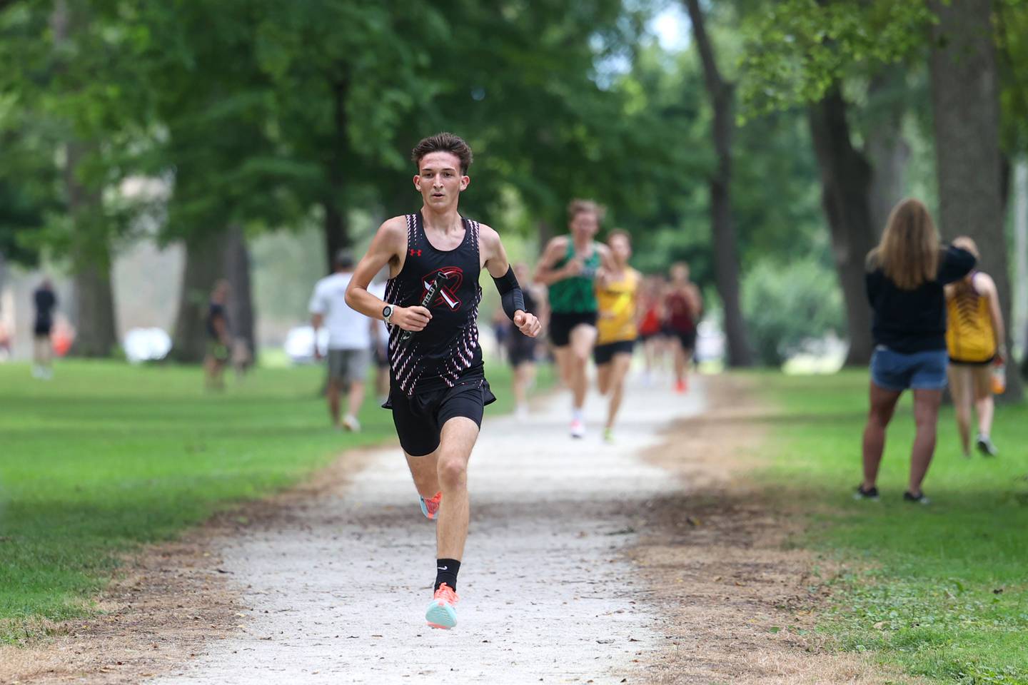 Bradley-Bourbonnais' Brayden Domont leads the pack in the first lap during the Irish Conditioner at Small Memorial Park in Kankakee on Wednesday, Sept. 3, 2025.