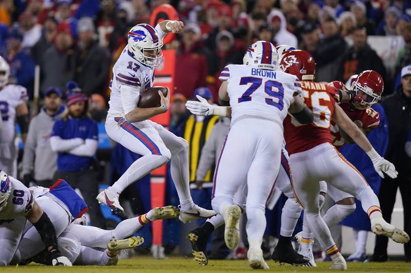 Buffalo Bills quarterback Josh Allen (17) runs up field during the first half of an NFL divisional round playoff football game against the Kansas City Chiefs in Kansas City, Mo. (AP Photo/Ed Zurga)