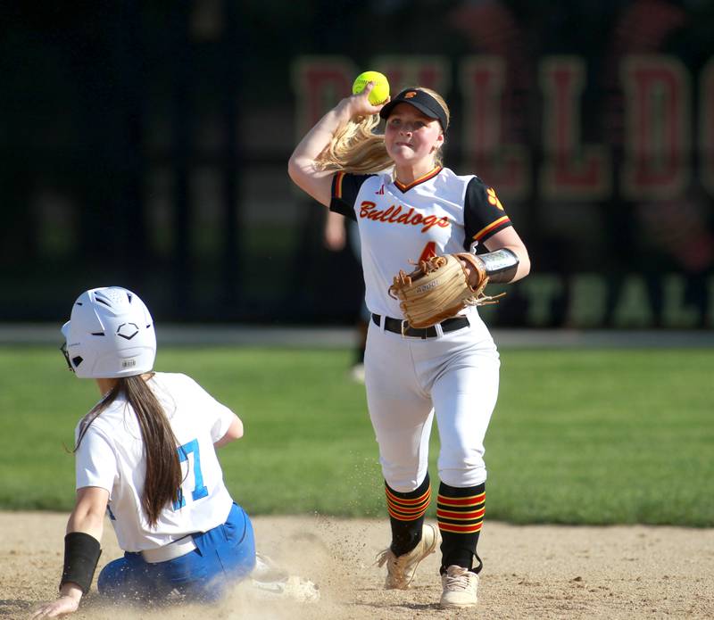 Batavia's Lexi Coonrod throws to first after getting Geneva's Kylie Gates out at second during a game on Tuesday, May 6, 2025 in Batavia.