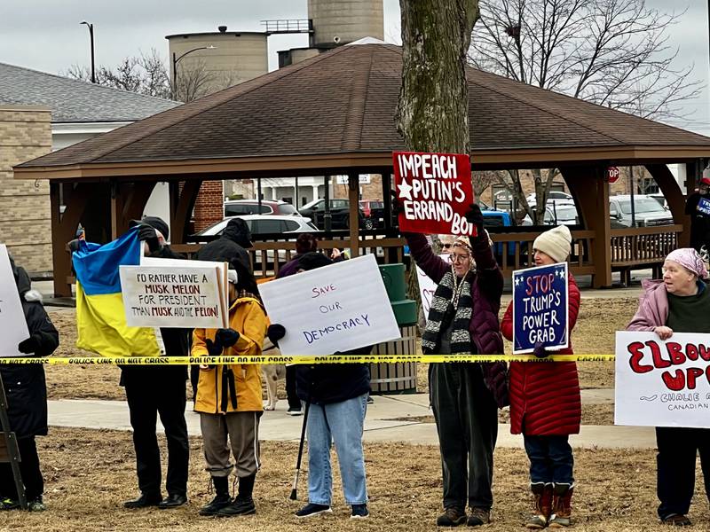 A crowd gathers to protest President Donald Trump and his administration in Sterling, Illinois, on Friday, March 7, 2025.