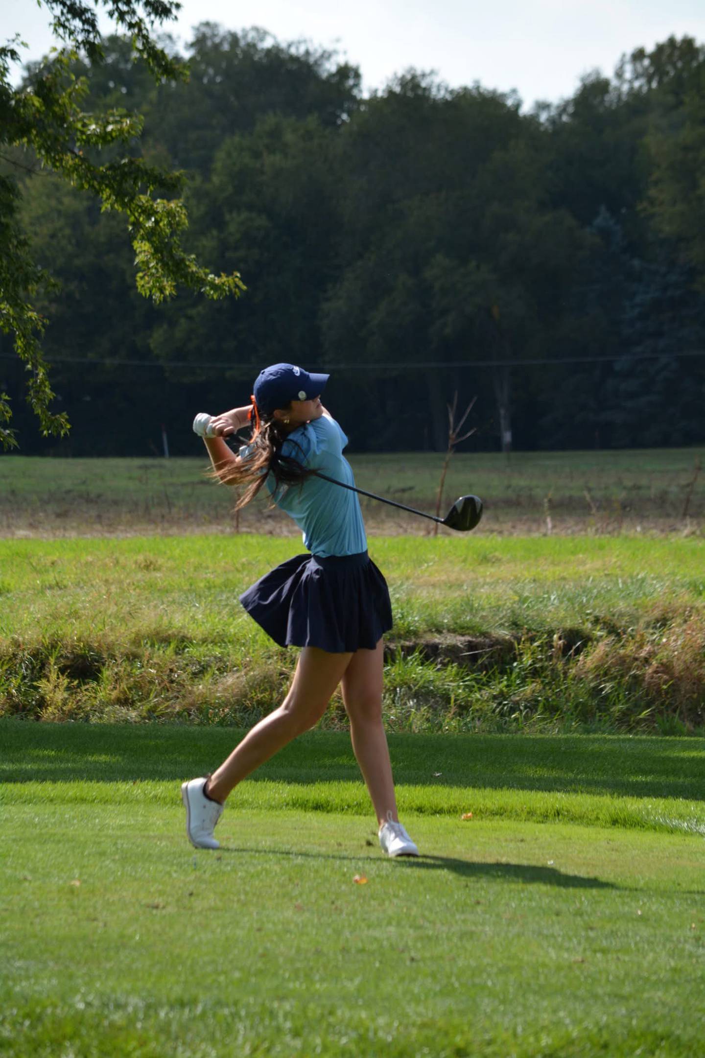 Oswego Co-Op sophomore Alli Wiertel follows through on a shot during the Class 2A state golf tournament at Hickory Point Golf Course.