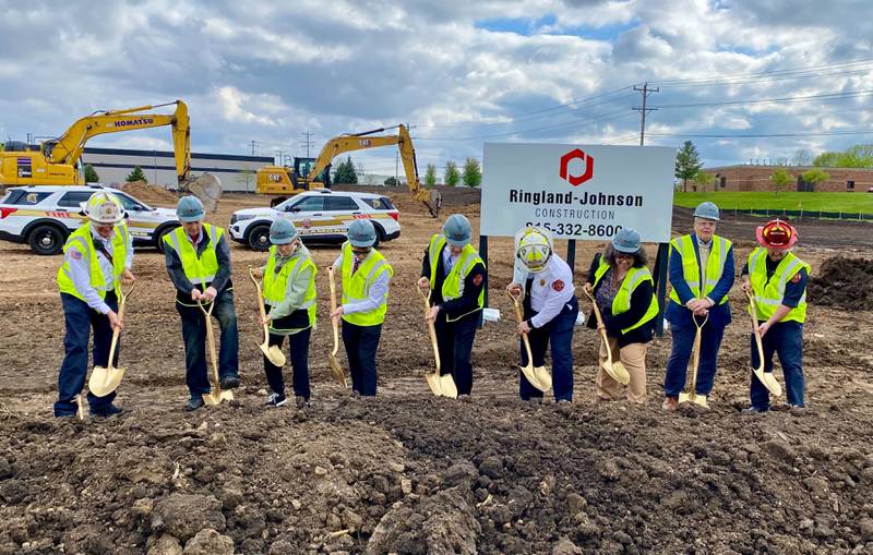 City of Sycamore officials, including members of the Sycamore City Council, Mayor Steve Braser (second from right), City Manager Michael Hall (middle) and Fire Chief Bart Gilmore (four from right) shovel the first dirt during a groundbreaking ceremony for the city's new fire station on Monday, May 5, 2025, at 1351 S. Prairie Drive, Sycamore.