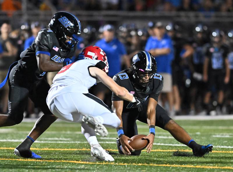 Lincoln-Way East's Jonas Williams recovers a loose ball during a non-conference game against Maine South on Friday, Aug. 30, 2024, at Frankfort. (Dean Reid for Shaw Local News Network)