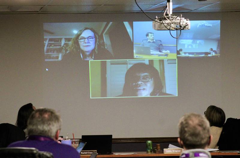 The Dixon Board of Education is briefed  during a video conference with Anne Noble, top left, managing director of public financing at Stifel in St. Louis, and Raphaliata McKenzie, center, senior vice president of Speer Financial in Chicago, about the district's long-range plan to restructure its debt starting with $650,000 taxable general obligation refunding school bonds.